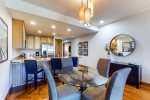 Dining room table and barstool seating provides plenty of space for entertaining